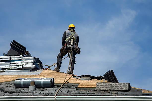 Professional Storm Damage Roof Repair technician working in Otis, MA